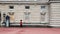 British Royal guards guard the entrance to Buckingham Palace, London, UK