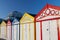 British seaside holiday resort beach huts in a row.