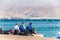 British swimming team sportsmen sitting on the beach during the training day in Red Sea waters in Eilat, Israel