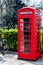 British Telecoms telephone box near a park in London