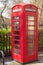 British Telecoms telephone box near a park in London