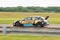 British Touring Car on the track at Thruxton with blurred background, panning effect