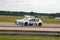 British Touring Car on the track at Thruxton with blurred background, panning effect