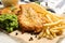 British traditional fish, potato chips and mushy peas on table