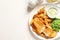 British Traditional Fish and potato chips on wooden background, flat lay