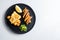 British  traditional food fish and chips with peas and a slice of lemon view from top overhead white textured background space for