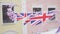 British Union Jack bunting flags against the wall of the house
