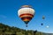 Brixen im Thale, Tirol/Austria - September 26 2018: Colorful hot-air balloon just after take-off flying in the afternoon from