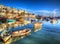 Brixham boats Devon England UK English harbour with brilliant blue sky