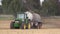 BRNO, CZECH REPUBLIC, SEPTEMBER 17, 2017: Tractor John Deere special trailer spreading fertilizer of slurry on field