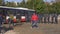 Brno, Czechia - October 08, 2021: Group of police commando confronting football hooligans entering bus, one attacker neutralized.