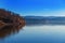 Brno Dam Czech Republic Europe. Water surface and dam. In the background is the housing estate Bystrc and Kohoutovice. The sky is