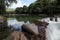 A broad dam spans across the river