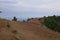 Broad view of a person hiking on the edge of volcanic crater