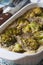Broccoli casserole with eggs and spices macro rustic. Vertical