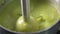 Broccoli cooking close-up blender. Cook green cream soup with vegetables. Slow motion