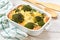 Broccoli egg casserole in baking dish on a cuisine table