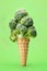 Broccoli in a ice cream comb over green background. Generative Ai