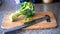 Broccoli with Knife on Cutting Board