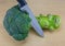 Broccoli with knife on table