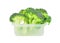 Broccoli in a plastic container.