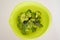 Broccoli in vibrant green bowl