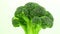 Broccoli whole cabbage rotates vertically, fresh green vegetable.