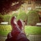 Brogue shoes resting on a luggage in park