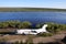 Broken abandoned airplane at Kolyma river coast