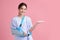 Broken arm,  Beautiful young asian with happy smiling woman on pink background, healthcare concept, accident, insurance, life