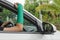 Broken arm with green cast on blurred woman fitness group - yoga