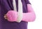 Broken arm in pink plaster cast and sling