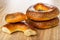 Broken baranka, whole baked bread rings with poppy on wooden table