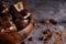 Broken black and white chocolate in wooden bowl. Pieces of chocolates on a gray stone table