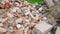 Broken bricks flying in construction rubbish heap dump