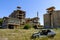 Broken car in front of old abandoned fabric on the island of Sardinia, Italy