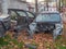 Broken cars near the car workshop. Cars in the landfill. A pile of scrap metal