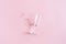 Broken champagne flute with splinters on pink background with copy space. Concept fight against alcoholism, drunkenness and