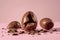 Broken chocolate egg on pink background, easter chocolates picture