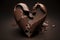 A broken chocolate heart with some melted chocolate splashes near it. Created with Generative AI