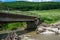 Broken concrete bridge after several heavy floods