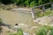 Broken concrete bridge after several heavy floods