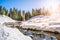 Broken dam in winter mountains