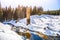 Broken dam in winter mountains