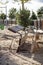 Broken and damaged wooden bench on a playground park, vandalism concept