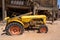 The Broken down vintage tractor, in the tourist trap Goldfield ghost town, an old mining town,