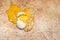 Broken egg on the stone marble floor, Front focus Background