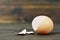 Broken eggshell on wooden background