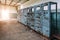 Broken electrical switchgear cabinets with control panels in abandoned factory