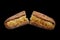 Broken fresh baguette on black background, french baquette menu design